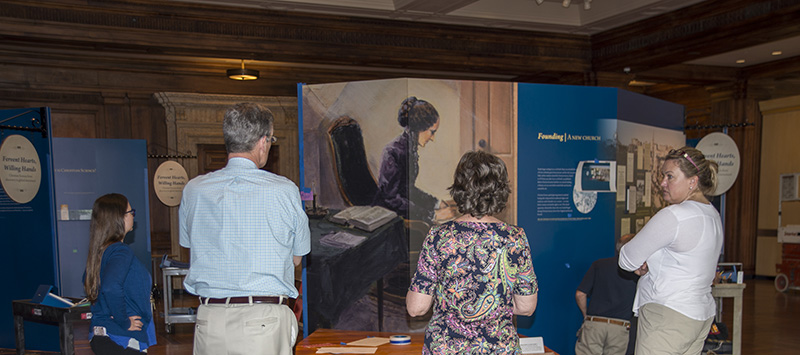 Exhibit team looking at all the items