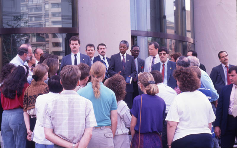 Nelson Mandela addresses a group of reporters at The Christian Science Monitor